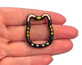 Llavero y colgante para bolso con cabeza de gato negro esmaltada – 35 x 28 mm