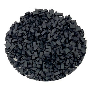 May include: A large quantity of black rectangular seed beads. The beads have two holes on each side.