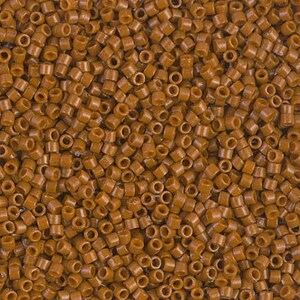May include: Close-up of a pile of small, cylindrical, brown hair extension beads. The beads are evenly distributed, creating a textured surface. The color is a warm, medium brown.