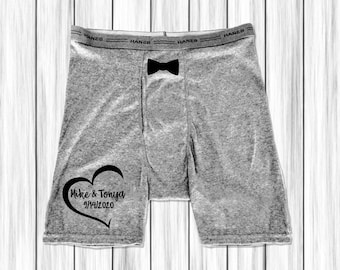 May include: Gray boxer shorts with a black bow tie and a heart with the text "Mike & Tonya 9/14/2020" printed on the left leg.
