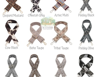 May include: Ten different patterned fabric straps for bags, including leopard, cheetah, Aztec, paisley, cow print, boho, tribal, camo, and solid colors. The straps are all in a criss-cross pattern and have gold metal hardware.