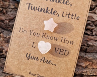 May include: A brown card with the text "Twinkle, Twinkle, Little Do You Know How Loved You Are..." with a small pink star and heart shaped crystal on top.