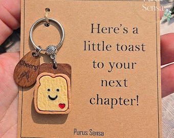 NEXT CHAPTER gift for new chapter. funny novelty little toast keyring for celebrations. Congratulations gift. Fresh start. Graduation.