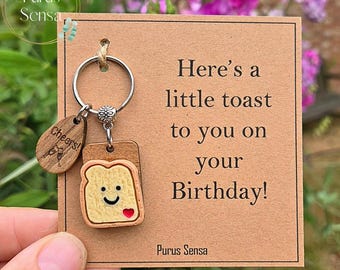 PERSONALISED BIRTHDAY gift for birthday. funny novelty little toast keyring for celebrations. Cheers. Happy birthday keyring on gift card.