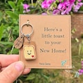 NEW HOME gift for new home. funny novelty little toast keyring for celebrations. Congratulations gift. Fresh start. House warming gift. product logo