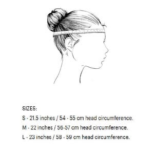 May include: A black and white line drawing of a head in profile with a measuring tape wrapped around the forehead. Text lists sizes: S - 21.5 inches, M - 22 inches, and L - 23 inches, corresponding to specific head circumference measurements.