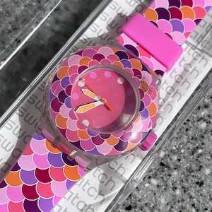 Swatch Watch Scuba PEDRINHA AZUL SUUK110 Skeleton Pink And Purple Watch unworn new in box with battery working well