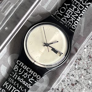 Swatch Watch NEW RARE 50th ANNIVERSARY Manas GB747 Gold Promotion 34mm with fun band day date feature in original box with a battery running