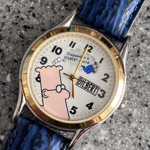 Orologio DILBERT vintage usato in ottime condizioni Il tuo orologio Cube o Relic FOSSIL funziona con batteria nuova, scatola Fossil, ottimo articolo da collezione