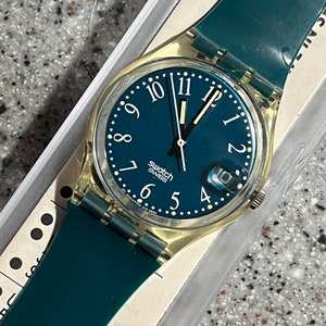 Vintage Swatch Watch 34mm Grune-Lui green swatch early 90s running with a battery from estate in an original box