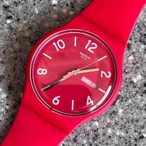 HOT Pink Swatch Rebel Watch with day date feature 41mm largest face plastic band NEW unworn with battery and box fabulous swatch everyday