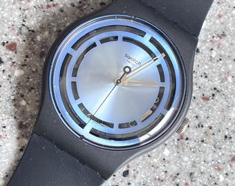 NEW larger face 41mm Swatch watch blue fun grill new in box unworn great bioceramic with a flexible band fun perforations BLUE fun everyday