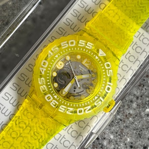 New Never Worn scuba 200 swatch watch 44mm face SUUJ101 Lemon Profond color running with a battery in box great swatch watch everyday
