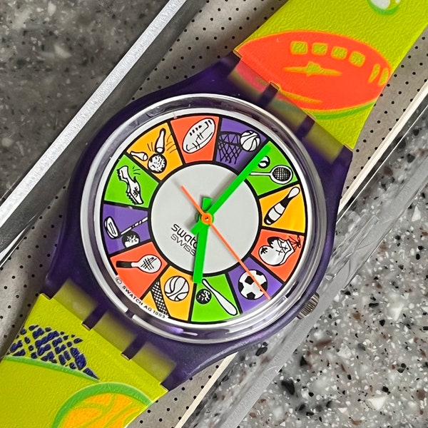 NEW never worn in original box 1994 Vintage 34mm Swatch Watch called Cheerleader GV107 fun neon colors with sports theme great swatch