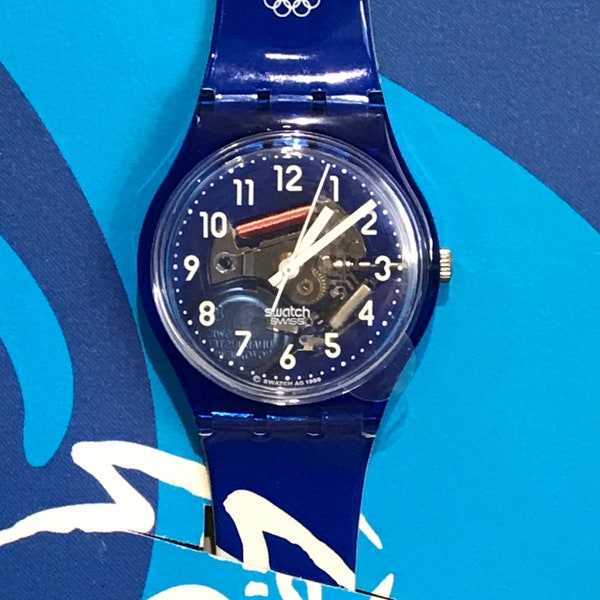 Never worn Commemorative limited edition Sydney 2000 GN182 Glorious Blue Swatch Watch with original box and paperwork working condition