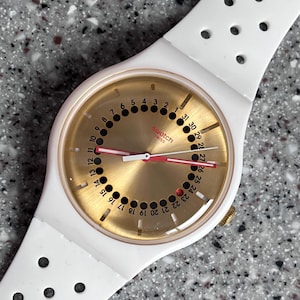 Swatch Watch swiss large 41mm brand new in box with silicone everyday wearable band new battery running date feature 31 dots on inner ring