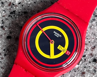 Fabulous 34mm flexible NEW unworn everyday Swatch Watch with Concentric Circles reminds me of captain america day and date feature fabulous
