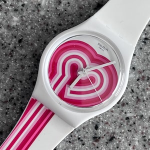 Swatch Watch 70s inspired called Beat Pink bright pink on white background 34mm NEW never worn in box with battery running well