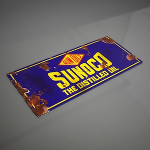 May include: A vintage blue and yellow metal sign with the text "SUNOCO THE DISTILLED OIL" and a red diamond with the text "SUN OIL" inside.