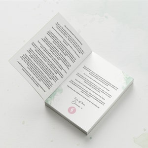 May include: An open book with a green watercolor design on the cover. The text on the page reads "This book is for anyone who has felt the overwhelming despair of an eating disorder. For those who have experienced the utter loneliness in the addiction, but you are not alone and you are strong enough."
