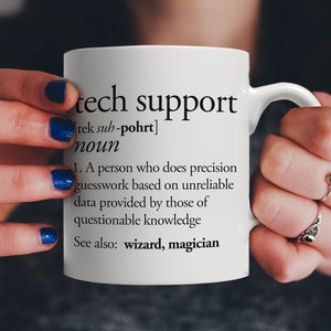 May include: White ceramic mug with a black and white definition of "tech support" printed on it. The definition reads: "A person who does precision guesswork based on unreliable data provided by those of questionable knowledge. See also: wizard, magician."