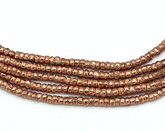 Perline etiopi Heishi minuscole fatte a mano (1,5 mm) - Perline africane forgiate a mano in rame riciclato - Upcycled - Perline del commercio tribale (86A052) Metallo