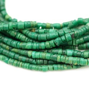 May include: A strand of green gemstone beads, each bead is a small cylinder with a slightly irregular shape.