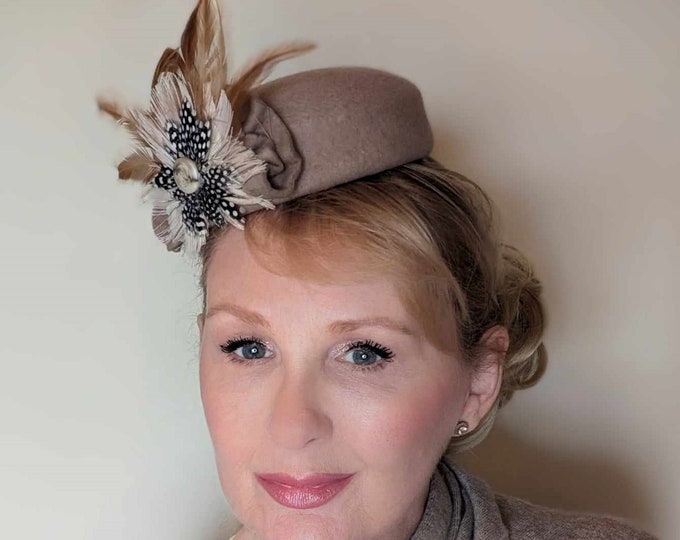 Cute, wool felt pillbox hat with feathers.  Great for winter racing or small winter wedding