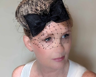 Stylish animal print pillbox cocktail hat, great for races, weddings or cocktail party