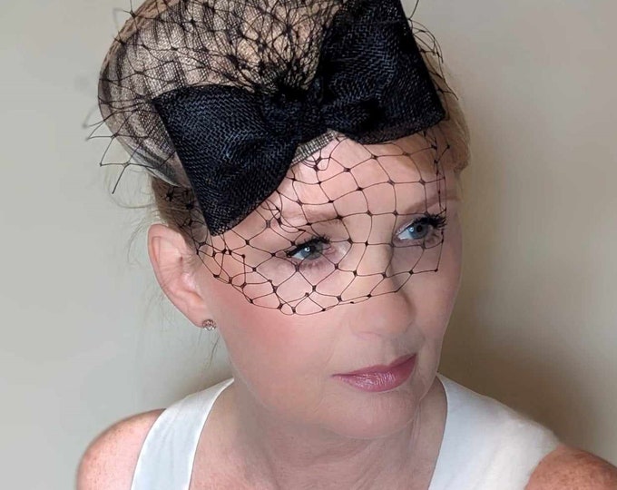Stylish animal print pillbox cocktail hat, great for races, weddings or cocktail party