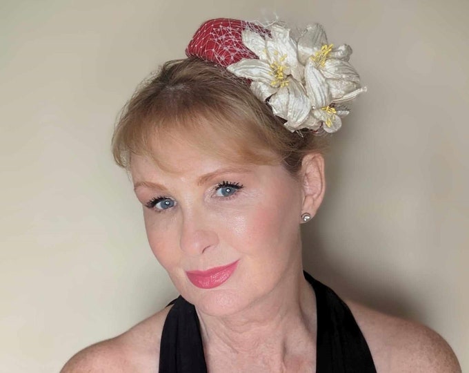 Red silk pillbox hat decorated with handmade silk lillies. Perfect for Mother of the bride, Ascot or ladies day races.