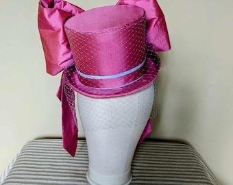 Pink silk top hat with contrasting blue tails. Perfect for Mother of the bride, Ascot or ladies day