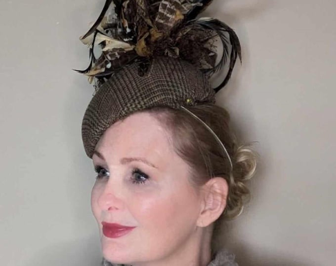 Stylish tweed percher hat, decorated with feathers and swirls. Perfect for Cheltenham festival or winter racing and weddings