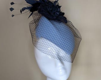 Beautiful pale blue and navy wool felt hat, decorated with feathers and velvet flowers. Perfect for Cheltenham festival.
