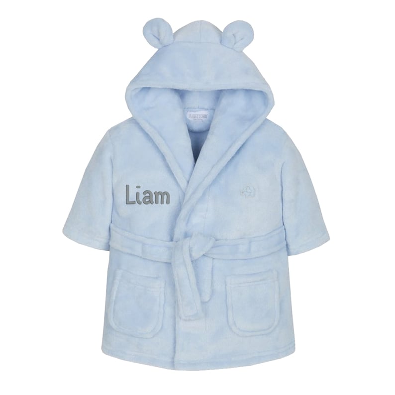 May include: Light blue hooded robe with bear ears, a tie belt, and two pockets. The robe is personalized with the name "Liam" embroidered on the front.