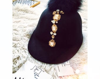 Black velvet hat with golden ornaments