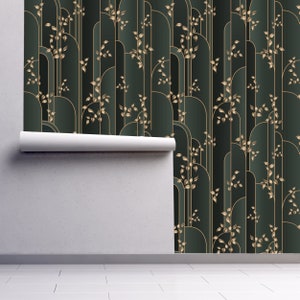 Grey and gold geometric Art Deco fabric peel and stick wallpaper on wall partially rolled up