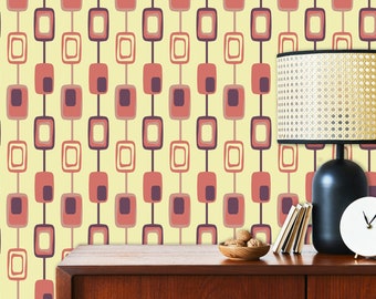 May include: A vintage-style wallpaper with a repeating pattern of red, purple, and beige squares. The wallpaper is displayed on a wall behind a wooden dresser with a lamp, clock, and bowl of nuts on top.