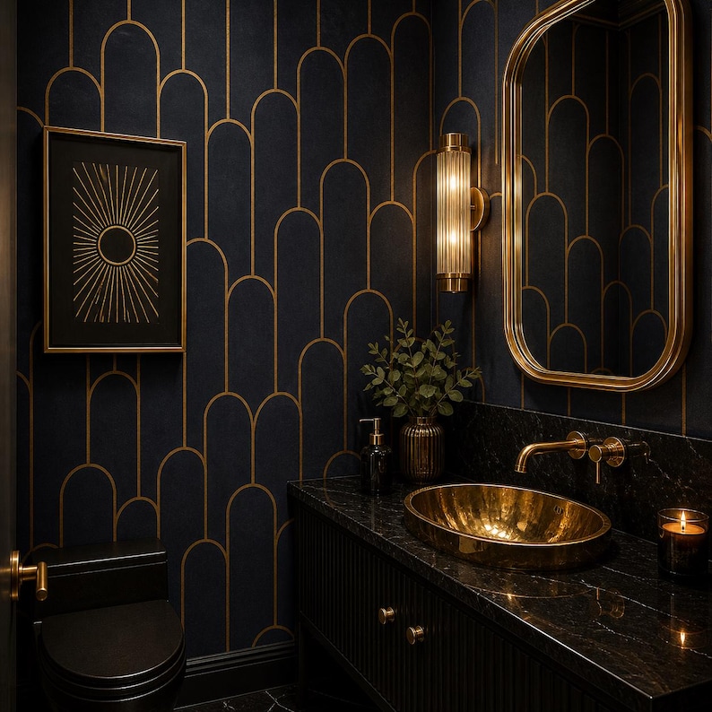 May include: A luxurious bathroom with a black and gold art deco theme. Features include a gold oval sink, a gold-framed mirror, and a black toilet. The walls are adorned with a dark blue wallpaper with gold arched patterns. A framed sunburst art piece hangs on the wall.