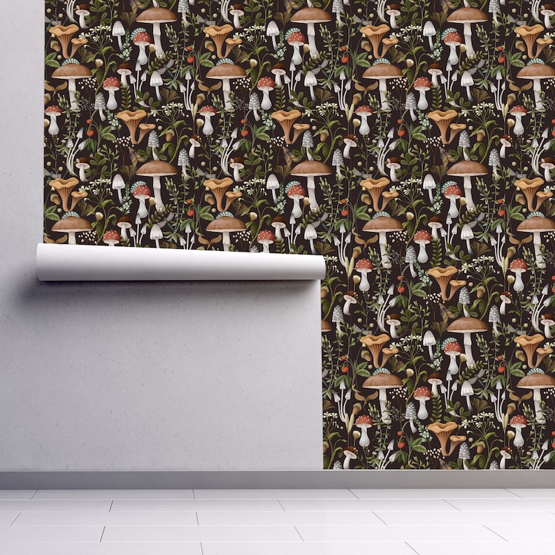 Dark botanical mushroom fabric peel and stick wallpaper on wall partially rolled up