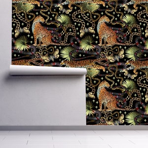 Black tropical cheetah print fabric peel and stick wallpaper on wall partially rolled up
