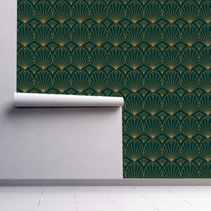 Black and gold antique Art Deco geometric fabric peel and stick wallpaper on wall partially rolled up