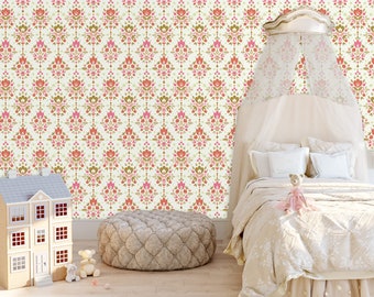 May include: A white canopy bed with a white and pink floral patterned wallpaper. The bed has a white comforter and a white pillow. There is a doll on the bed and a dollhouse in the foreground.