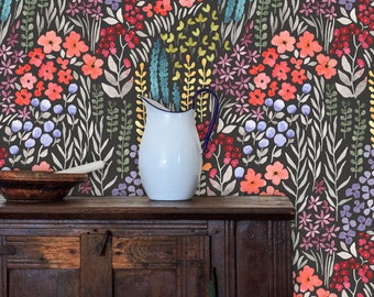 May include: A dark gray wallpaper with a floral pattern featuring colorful flowers and leaves. The wallpaper is displayed on a wooden cabinet with a white pitcher on top.