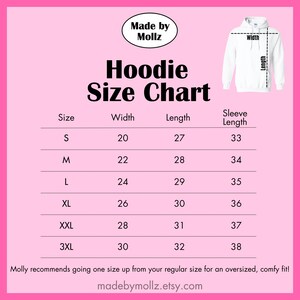 May include: A pink graphic with a white hoodie illustration and a size chart. The chart lists sizes S to 3XL, with corresponding width, length, and sleeve length measurements in inches. The text "Hoodie Size Chart" is prominently displayed.