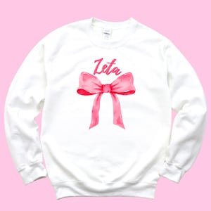 Zeta Tau Alpha Sweatshirt – Sweatshirt mit pinkfarbener Schleife und Rundhalsausschnitt