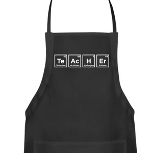 May include: Black apron with a white pocket and the text "TEACHER" spelled out using chemical element symbols.