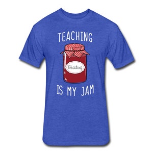 May include: A royal blue t-shirt with the text "TEACHING IS MY JAM" in white. A cartoon image of a jar of jam with a red lid and a white label that says "Reading" is in the centre of the shirt.