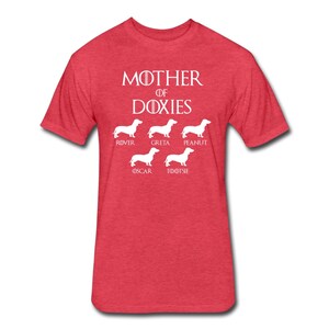 May include: Red t-shirt with white text that reads "Mother of Doxies" and features five white dachshund silhouettes with names below each: Rover, Greta, Peanut, Oscar, and Tootsie.