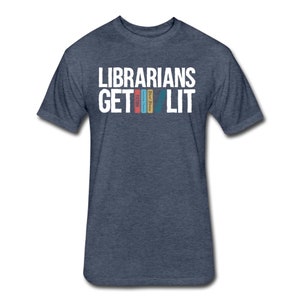 May include: A dark blue t-shirt with the text "Librarians Get Lit" in white. The text is stacked with the word "Get" above the word "Lit".  There are four colorful book spines stacked vertically between the words "Get" and "Lit".